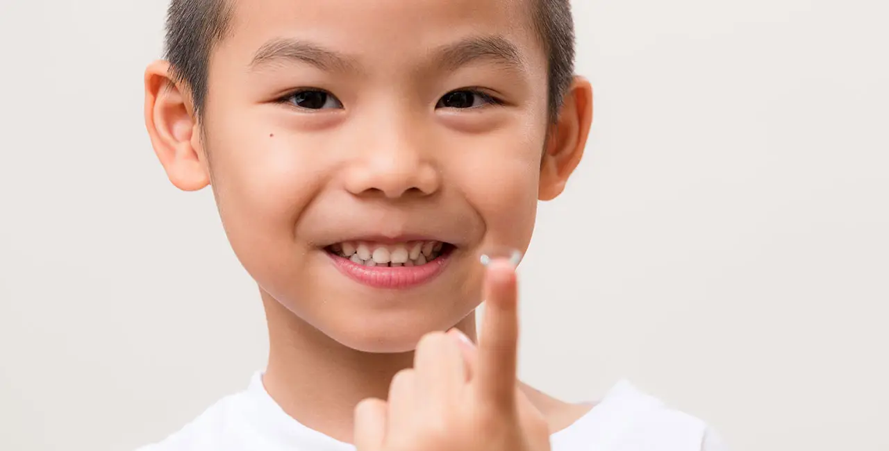 Young-Boy-Holding-Contacts